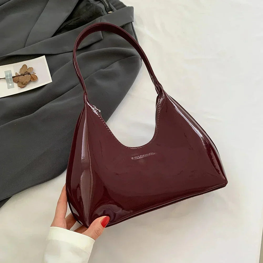 Elegant burgundy shoulder bag with a glossy finish