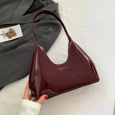 Elegant burgundy shoulder bag with a glossy finish