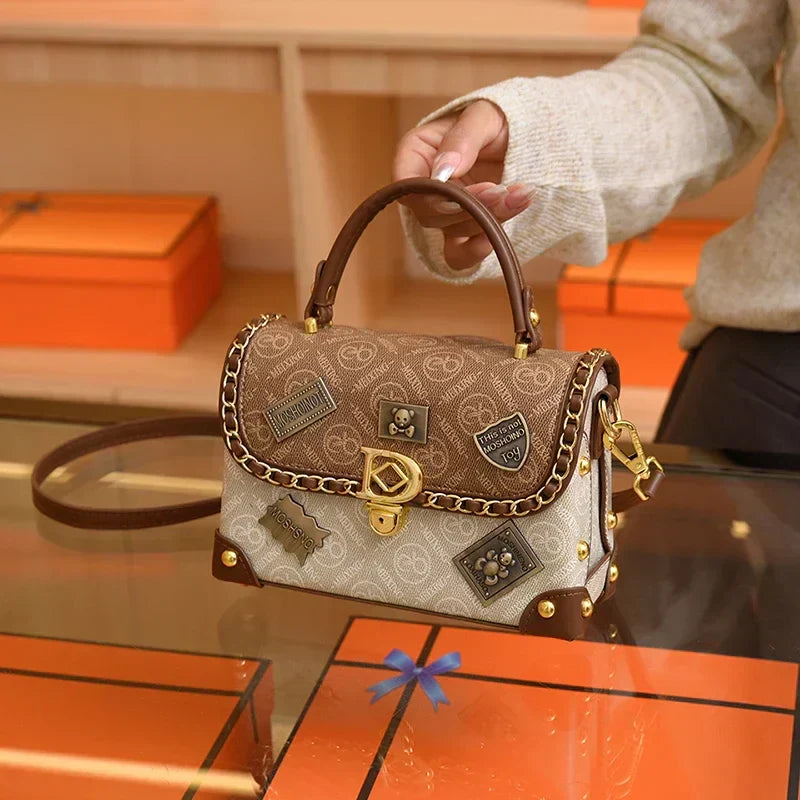 Retro shoulder bag with monogram and gold details Zelda™