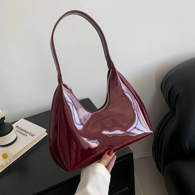 Elegant burgundy shoulder bag with a glossy finish