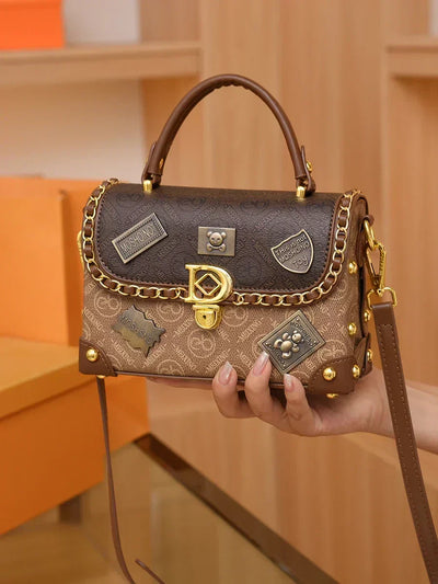 Retro shoulder bag with monogram and gold details Zelda™