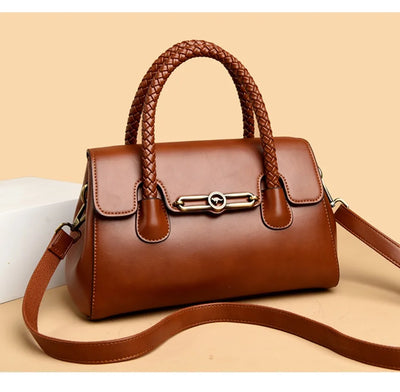 ronja™ – Classic Handbag with Woven Handle and Gold Accents