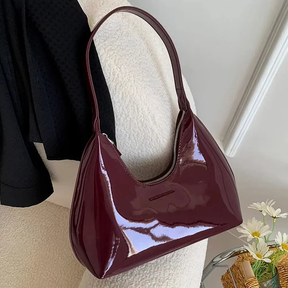 Elegant burgundy shoulder bag with a glossy finish