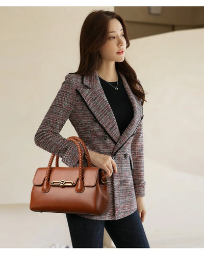 ronja™ – Classic Handbag with Woven Handle and Gold Accents
