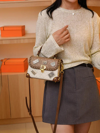 Retro shoulder bag with monogram and gold details Zelda™