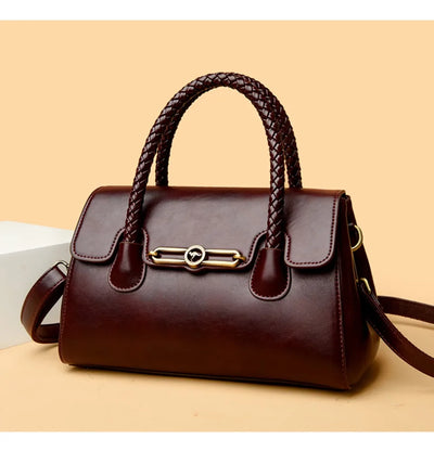 ronja™ – Classic Handbag with Woven Handle and Gold Accents