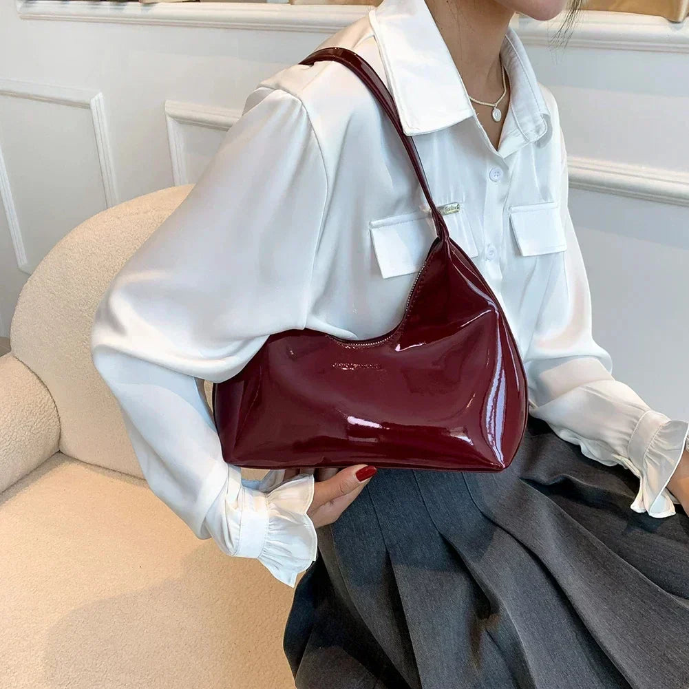 Elegant burgundy shoulder bag with a glossy finish