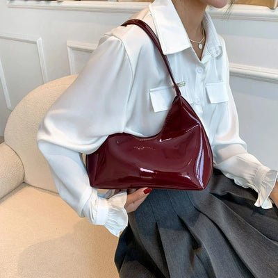 Elegant burgundy shoulder bag with a glossy finish