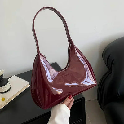 Elegant burgundy shoulder bag with a glossy finish