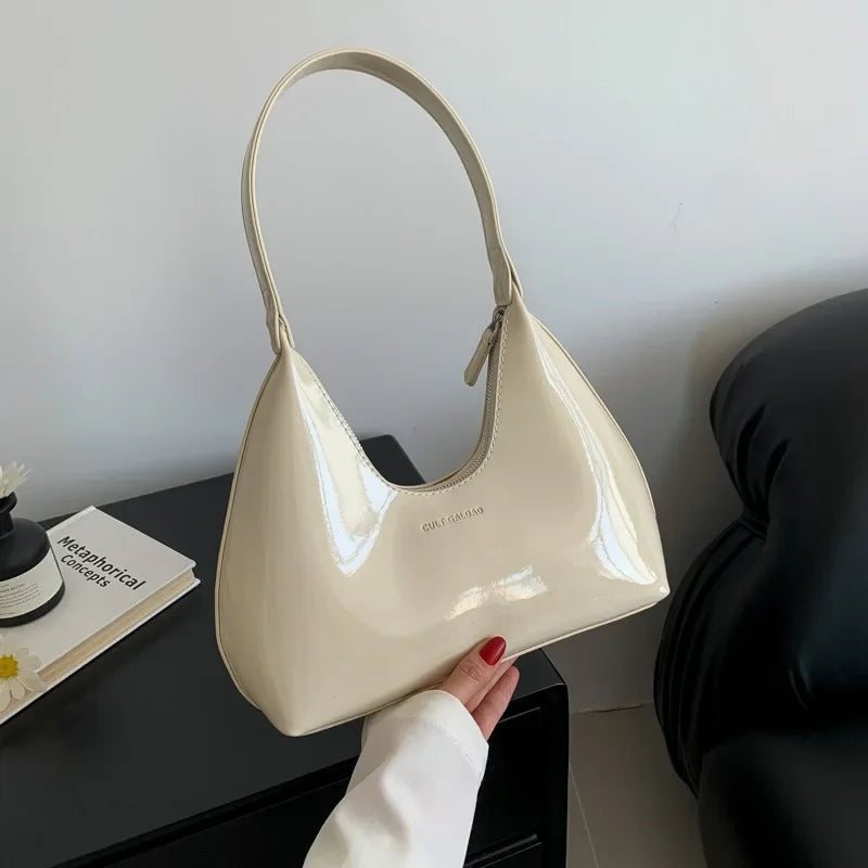 Elegant burgundy shoulder bag with a glossy finish