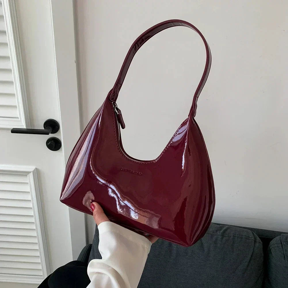 Elegant burgundy shoulder bag with a glossy finish