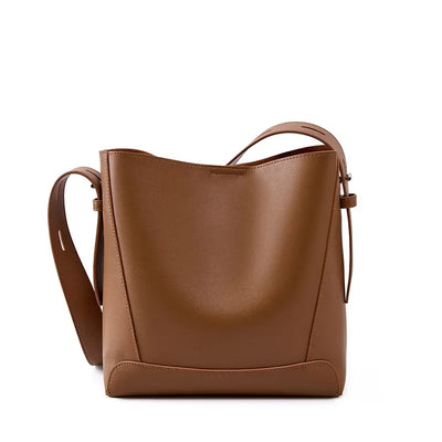 tine™ – Elegant shoulder bag in sand shade with strap-inspired handle