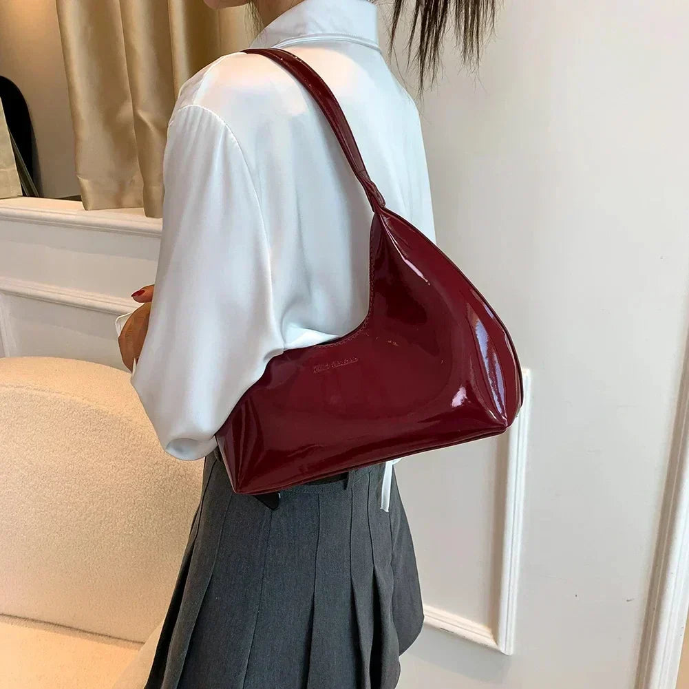 Elegant burgundy shoulder bag with a glossy finish