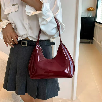 Elegant burgundy shoulder bag with a glossy finish